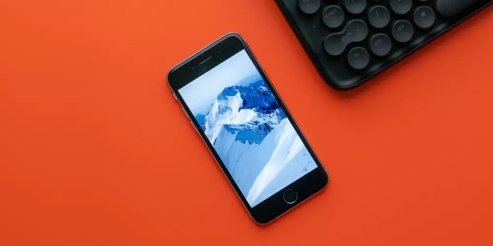 iPhone 6s in orange background