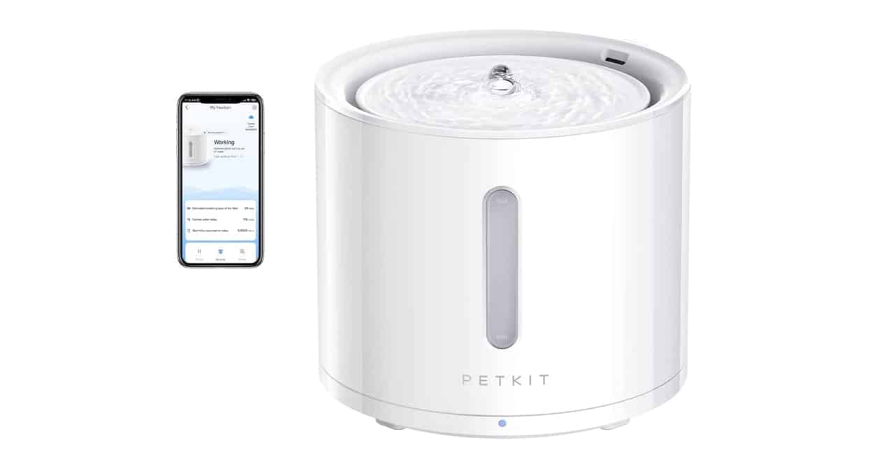 Petkit water dispenser next to a smartphone
