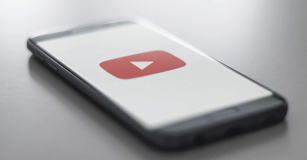 YouTube logo on mobile phone